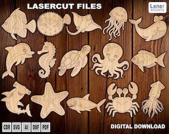 Op de afbeelding: Een verzameling van lichtgekleurde, lasergesneden houten vormen met diverse zeedieren, waaronder een vis, kogelvis, rog, kwal, walvis, dolfijn, zeepaardje, schildpad, octopus, zeester, haai, krab en inktvis met de tekst LASERCUT FILES.