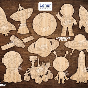 May include: Wooden laser-cut space-themed shapes, including rockets, an astronaut, a satellite, a planet, a UFO, and a dog in a space helmet. The image also includes the text "LASERCUT FILES" and "DIGITAL DOWNLOAD".