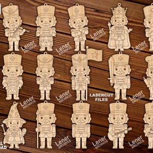 May include: A collection of wooden laser-cut Christmas ornaments in the shape of nutcrackers. Each ornament features a unique design, including a violinist, a drummer, a king, and a chef. The text "LASERCUT FILES" and "DIGITAL DOWNLOAD" are visible.