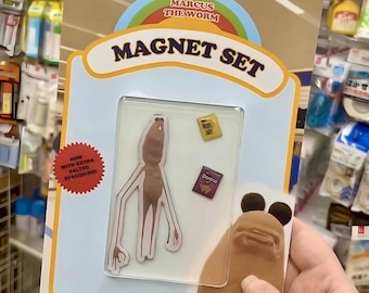 May include: A "Marcus the Worm" magnet set. The set includes a large worm magnet and two smaller magnets labeled "Moon Juice" and "Doritos". The packaging has the text "Pop or What?" and "How with extra salted seasoning!"