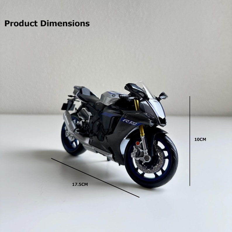 May include: A black and silver model motorcycle with blue accents. The model is 17.5 cm long and 10 cm high. The motorcycle has the letters "RM" on the side. The product dimensions are displayed in the image.