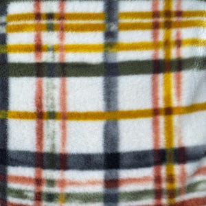 May include: Close-up of a soft, white fleece fabric with a plaid pattern. The plaid design features intersecting lines in shades of yellow, orange, green, gray, and brown, creating a textured, cozy appearance. The fabric is likely used for blankets or throws.