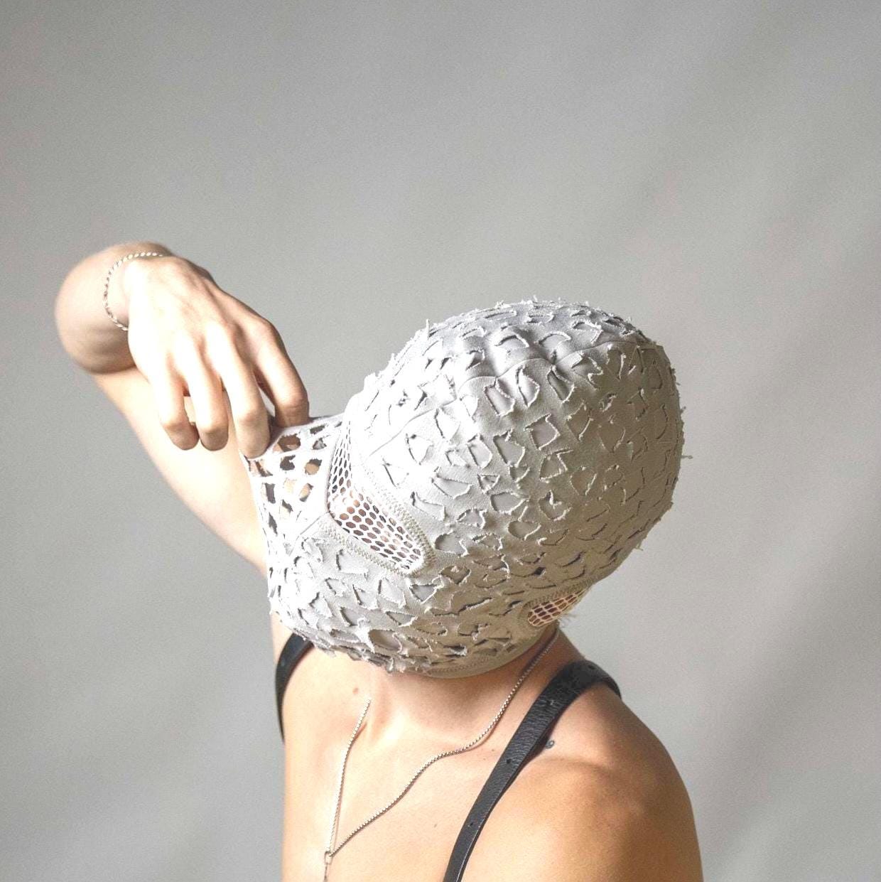 Handmade balaclava ski mask, torn and tattered cotton, tatty and ragged, shabby tacky Fragmented winter full faced thermal face protector
