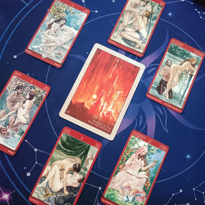 a collection of tarot cards with various illustrations, including scenes of couples, nature, and other symbolic imagery.