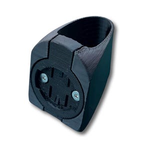 May include: A black 3D-printed bicycle computer mount featuring a textured finish, a circular mounting interface with two silver metal screws, and a curved cylindrical opening designed to attach securely to a bicycle handlebar stem.
