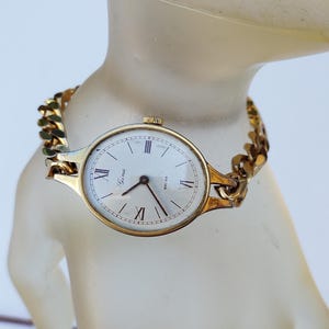 Jina Swiss Made Mechanical gold tone wrist watch