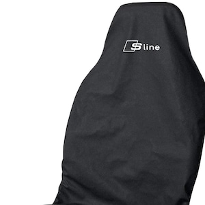 May include: Black car seat cover with the white text "S line" in a white rectangle. The cover is designed to fit a car seat and is made of a durable material. The cover is a solid black colour.