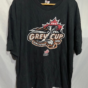 May include: Black t-shirt with a white and orange graphic of the 93rd Grey Cup 2005 in Vancouver. The graphic features a football and a maple leaf.