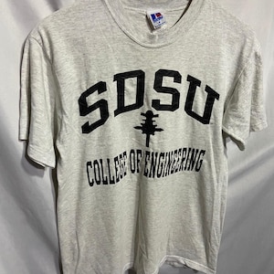 May include: A gray t-shirt with black text that reads "SDSU College of Engineering".