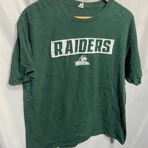 May include: Green t-shirt with white text that reads "RAIDERS" and a white wolf logo with the text "Wright State" underneath.