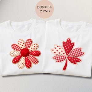 May include: Two white t-shirts with appliqued designs. One shirt features a red and white flower, the other a red and white maple leaf. The flower has a red centre and alternating petal patterns. The leaf has a mix of polka dots and plaid.