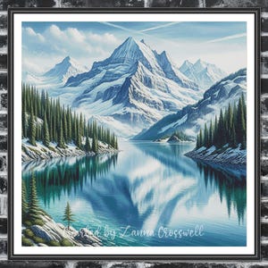 May include: A framed landscape print featuring a serene mountain scene. Snow-capped peaks tower over a calm lake, reflecting the sky and surrounding evergreen trees. The artwork is signed "Created by Lanna Crosswell" in the bottom corner.