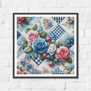 May include: Framed artwork showing a floral quilt design. The quilt features blue and white patterned squares, decorated with pink and blue roses and other floral accents. The artwork is set against a white brick wall.