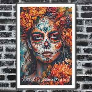 May include: A framed art print depicting a Day of the Dead sugar skull. The artwork showcases a woman's face with intricate patterns, floral elements, and vibrant colours of orange, teal, and red. The text "Charted by Lanna Crosswell" is visible.