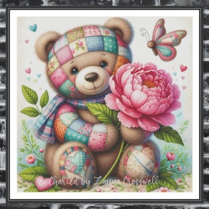 May include: A patchwork teddy bear holding a pink flower with a butterfly. The bear is wearing a blue and green scarf and is standing on a white background with hearts and flowers.