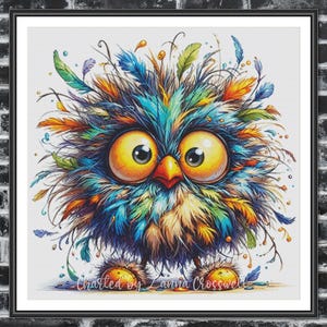 May include: A framed, colorful illustration of a cartoon owl with large yellow eyes and a bright orange beak. The owl is covered in a mix of blue, green, orange, and yellow feathers. The text "Charted by Zanna Crosswell" is at the bottom.