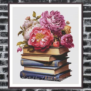 Könnte beinhalten: Gerahmter Druck mit einem Stapel Bücher, gekrönt von einem Strauß rosa und roter Pfingstrosen. Die Bücher sind blau und goldfarben, und das Kunstwerk ist vor einem weißen Hintergrund platziert. Der Text "Created by Lanna Crosswell" ist unten.