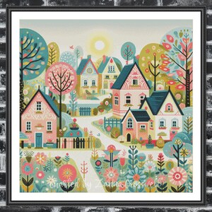 Könnte beinhalten: Gerahmter Kunstdruck mit einer farbenfrohen Dorflandschaft. Die Illustration zeigt pastellfarbene Häuser mit blauen und rosa Dächern, umgeben von Bäumen und Blumen. Der Text "Charted by Zanna Crosswell" ist sichtbar. Der Rahmen ist schwarz.