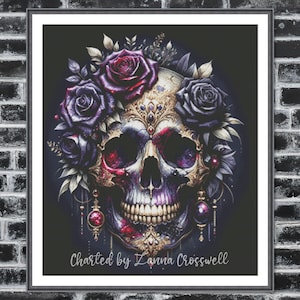 May include: A framed art print featuring a detailed skull design. The skull is adorned with purple and red roses, gold embellishments, and dangling earrings. The text "Charted by Zanna Crosswell" is at the bottom.