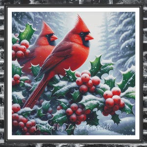 May include: A framed print featuring two vibrant red cardinals perched on holly branches laden with red berries and dusted with snow. The artwork is set against a snowy forest backdrop, with the text "Charted by Lanna Crosswell" at the bottom.