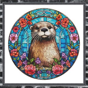 Può includere: Un design circolare incorniciato in vetro colorato con una lontra marrone con un volto dettagliato. La lontra è circondata da fiori colorati nelle tonalità del rosso, rosa e viola, su uno sfondo blu. Il testo "Charted by Laima Crosswell" è in basso.