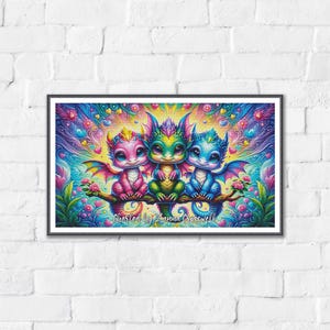 May include: A rectangular framed print featuring three colorful baby dragons sitting on a branch. The dragons are pink, green, and blue with large eyes and small wings. The background is a vibrant swirl of hearts and flowers with the text Created by Lanna Crasswell.