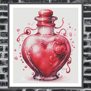 May include: A framed print featuring a watercolor illustration of a heart-shaped potion bottle in shades of red. The bottle has a decorative rose and swirls, with small heart accents. The text "Charted by Lanna Crosswell" is at the bottom.