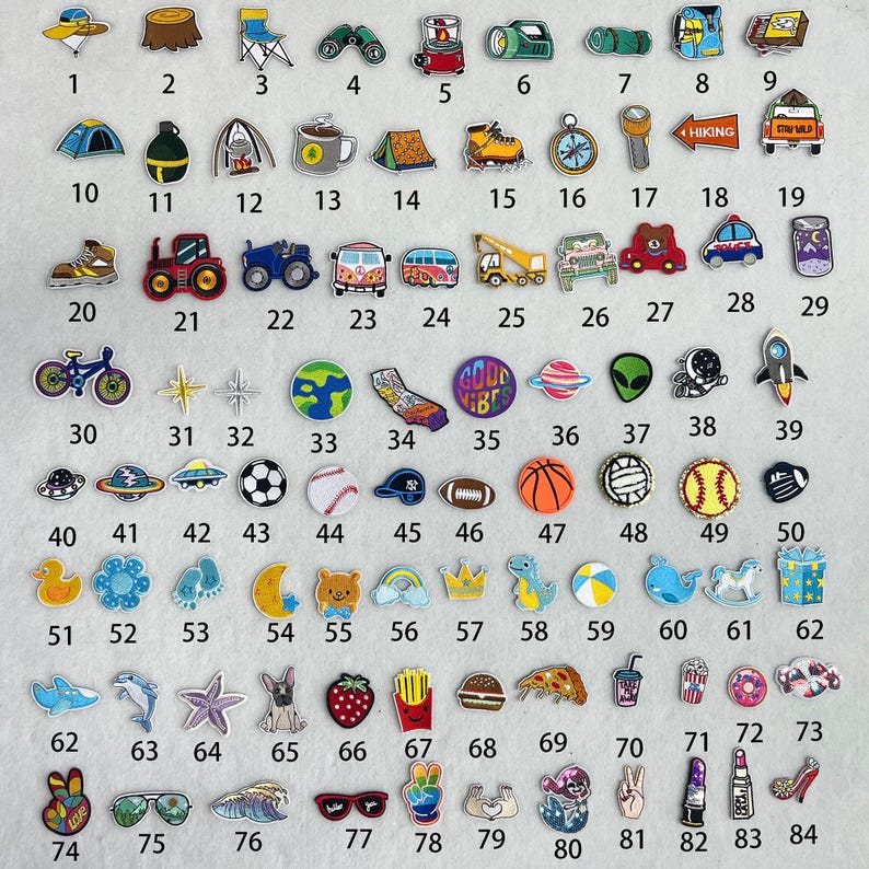 May include: A collection of 84 colorful embroidered iron-on patches featuring various themes, including camping, travel, sports, animals, and food. The patches are arranged in a grid pattern on a white background.