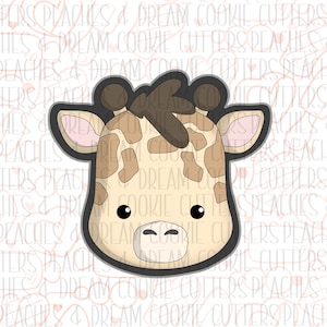 May include: A brown and tan giraffe cookie cutter with a black outline. The giraffe has a brown spot pattern and large black eyes.