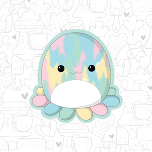 May include: A cute cartoon octopus with a tie-dye pattern in shades of pink, blue, yellow, and green. The octopus has a white belly and big black eyes.