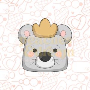 May include: A gray cartoon mouse wearing a gold crown. The mouse has pink cheeks, black eyes, and a black nose. The background is a light pink pattern of hearts and kitchen utensils.