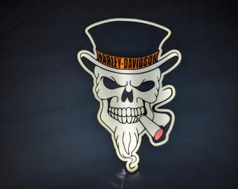 Luz de bicicleta con calavera humeante