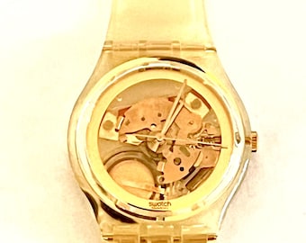 Reloj Swatch vintage dorado en gelatina