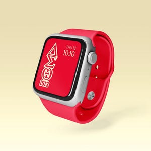 May include: A red Apple Watch with a white band and a white face. The face displays the date, time, and a white Greek letter logo with the text "1913".