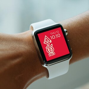 May include: A white smartwatch with a red face displaying the time 10:10 and the text "THU 12". The face also features a white Greek letter design with the text "1913".