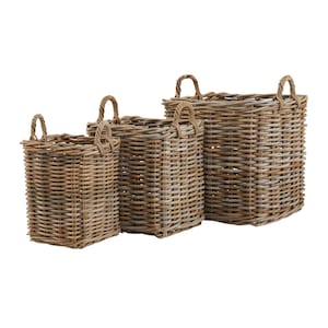 May include: Set of three woven wicker baskets with handles. The baskets are different sizes and are arranged in a row from largest to smallest.