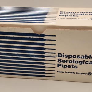 May include: A cardboard box with blue and white striped design on the top and side. The box contains "Disposable Serological Pipets" and the "Fisher Scientific Company" logo.