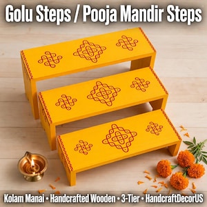 May include: A three-tier yellow wooden display stand featuring red geometric kolam patterns on each step. The steps are arranged in a cascading formation. The text Golu Steps / Pooja Mandir Steps and Kolam Manai - Handcrafted Wooden 3-Tier - HandcraftDecorUS is visible.