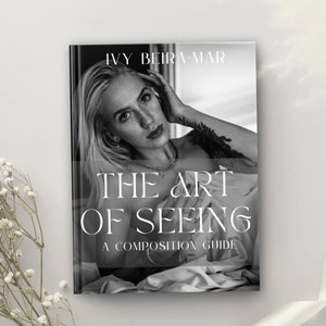 Op de afbeelding: Zwart-wit boekcover met de titel "THE ART OF SEEING" door Ivy Beira-Mar. De cover toont een blonde vrouw met een ketting en een tatoeage. Het boek is een compositiegids.