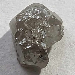 100% Natural uncut ROUGH DIAMOND of 2.09 carats. 7.7mm x 6.5mm x 5.2mm. Very beautiful rough diamond and would be very pretty on jewelry.