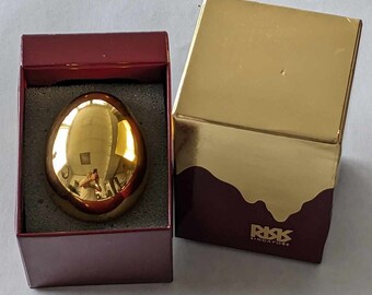 24k Gold plated EGG with Support. RISIS Singapore Collection. Comes with its original box. The egg is in perfect condition. 56mm X 43mm.