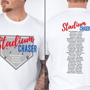 May include: White t-shirt with a gray baseball diamond graphic and the text "Stadium Chaser" in red and blue. The back of the shirt lists 30 ballparks, 26 cities, 15 states, and 1 province.