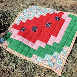 Patchwork crawling blanket with watermelon motif