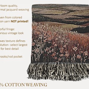 May include: A cotton woven throw blanket with a landscape design. The blanket features a detailed depiction of a field with flowers in shades of brown, green, and red. It has a fringe along the bottom edge and the text "100% COTTON WEAVING".