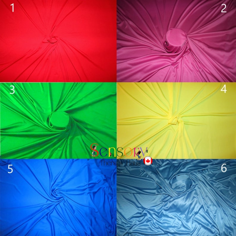 May include: Six different colours of fabric swirled into a spiral shape. The colours are red, pink, green, yellow, blue, and light blue.