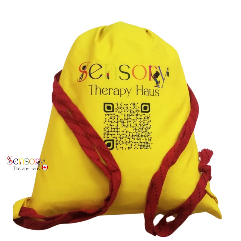 May include: Yellow drawstring bag with red drawstrings. The bag has a logo that says "Sensory Therapy Haus" and a black and white QR code.