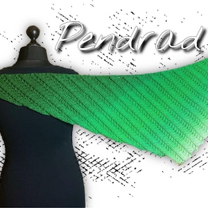 May include: A green and white gradient knitted shawl with a textured pattern. The shawl is draped over a black mannequin.