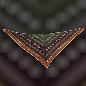May include: A triangular crocheted shawl with a gradient of brown, green, and orange colors. The shawl has a delicate lace pattern with small white flowers.