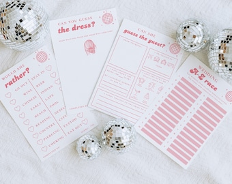 May include: A set of pink and white bridal shower game cards with a disco ball theme. The cards include games like "Would She Rather?", "Can You Guess the Dress?", "Can She Guess the Guest?" and "Wedding A-Z Race".
