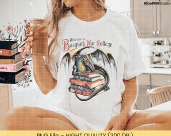 May include: White t-shirt featuring a dragon perched atop a stack of books, with the text "Welcome to Basgiath War College." The dragon is green, black, and gray with large wings. The books are in shades of red, brown, and gold.